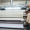 Operator loading Monto Antonio heat press