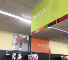 fabric sign hanging in a pet store