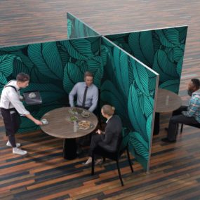 Protective barriers separating tables in a restaurant dining room