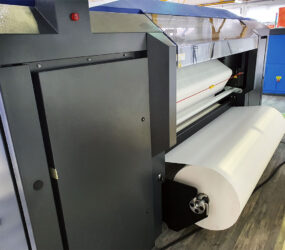 OnPaper 1900 fabric printer with jumbo transfer paper unwinder